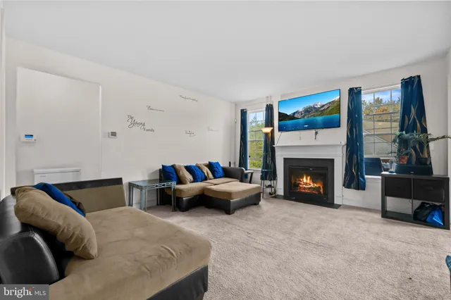 a bedroom with furniture and a fireplace