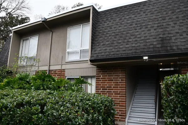 a view of a wooden door of the house