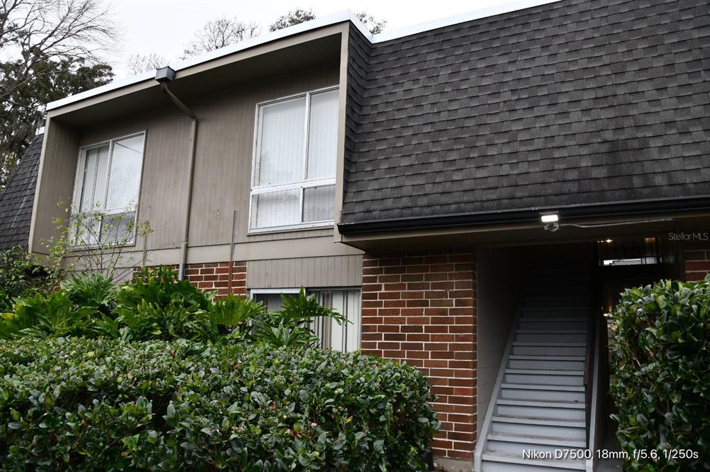 1700 Southwest 16th Court, Unit M21 Gainesville, FL 32608 - Photo 2 of 13 a view of a wooden door of the house