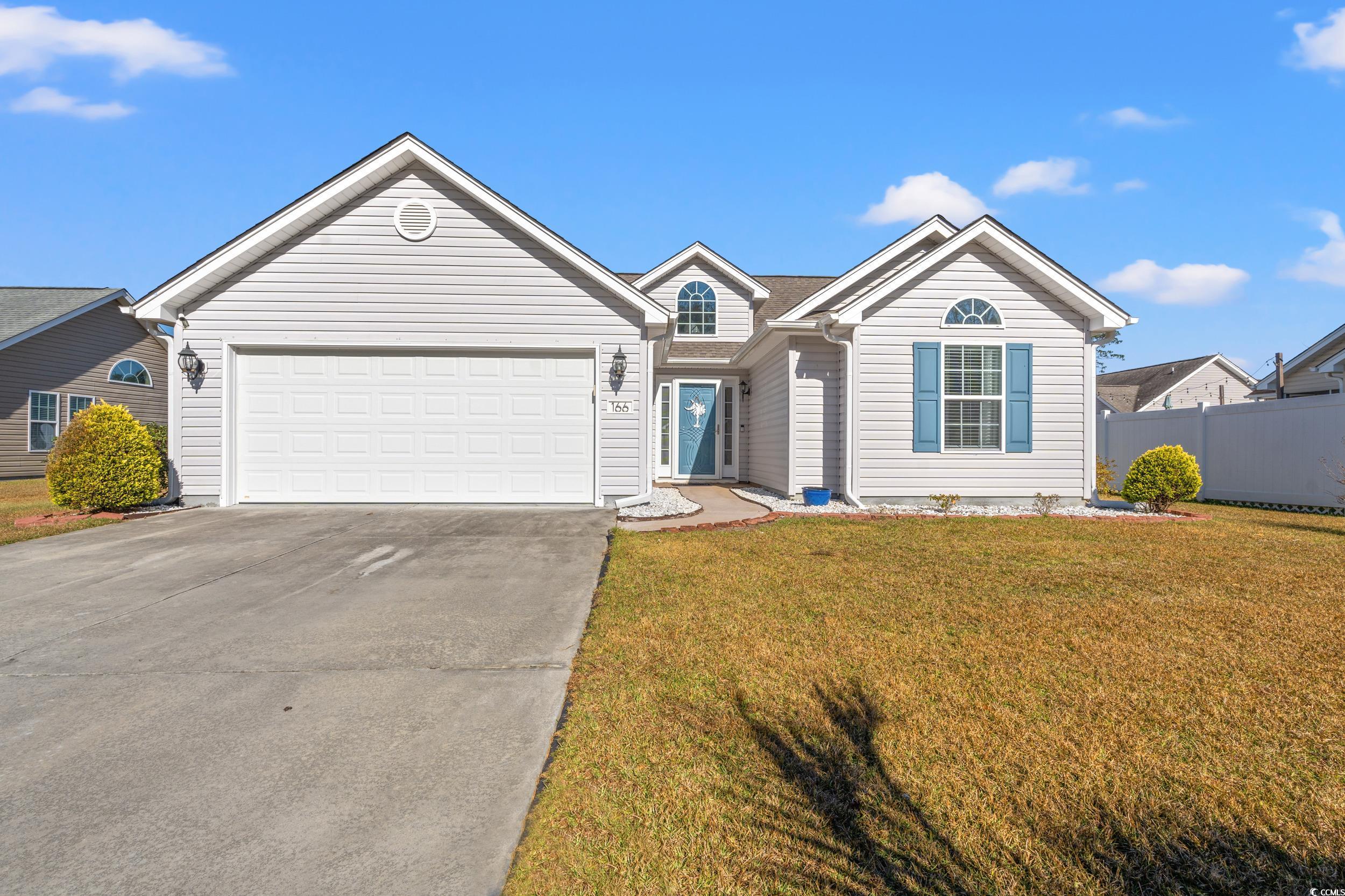 166 Woodland Park Loop Murrells Inlet, SC 29576 - Photo 1 of 39 Ranch-style house with a front yard and a garage