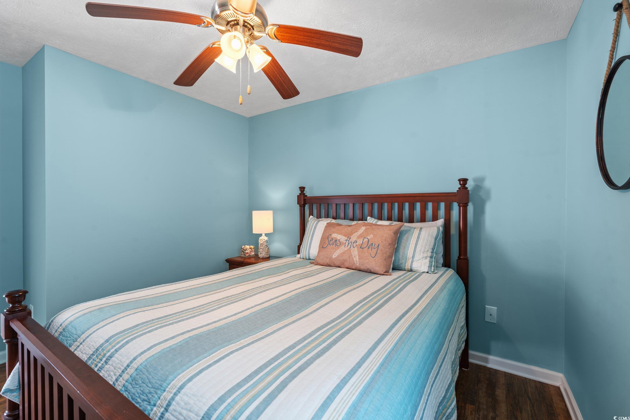 166 Woodland Park Loop Murrells Inlet, SC 29576 - Photo 17 of 39 Bedroom featuring a textured ceiling, ceiling fan,