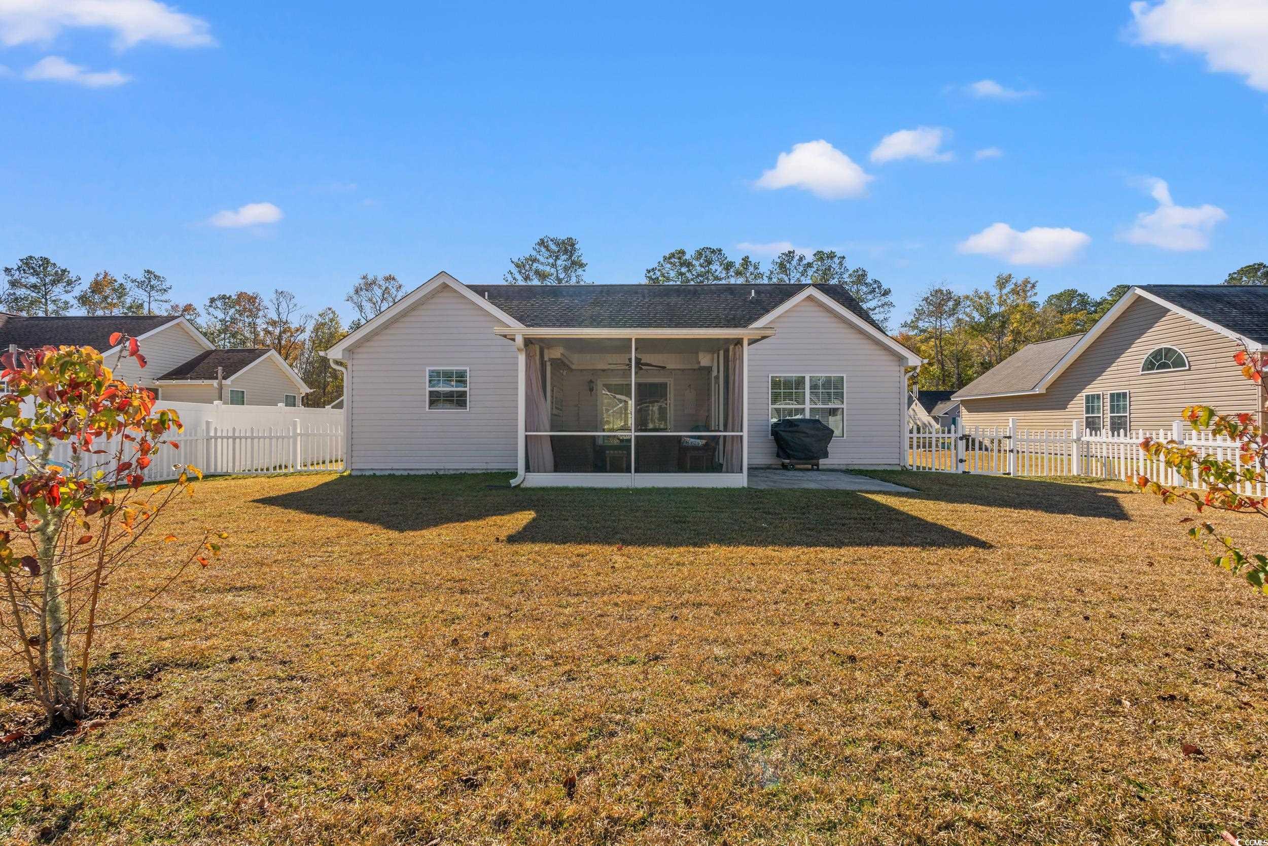 166 Woodland Park Loop Murrells Inlet, SC 29576 - Photo 2 of 39 Back of house with a sunroom and a yard