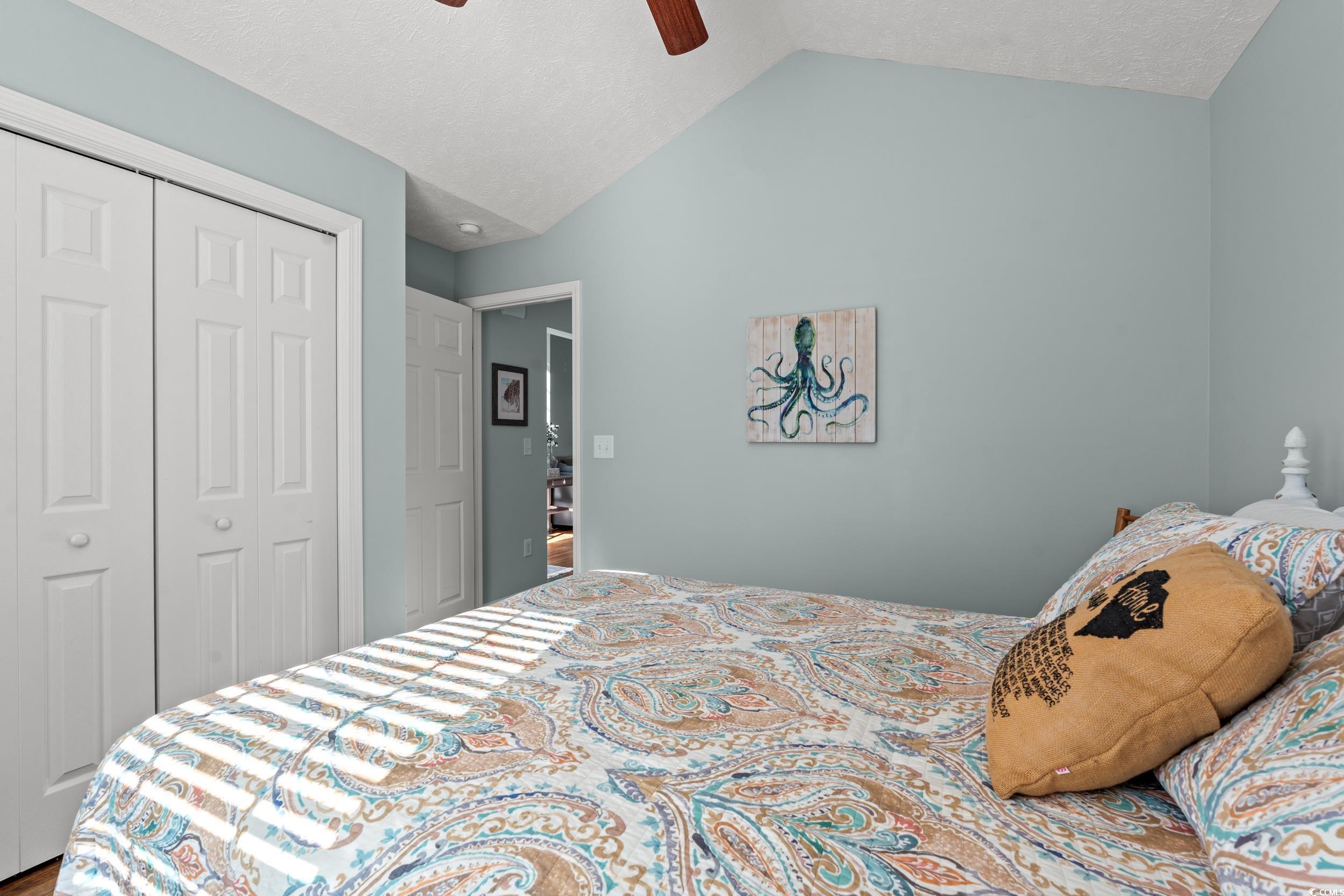 166 Woodland Park Loop Murrells Inlet, SC 29576 - Photo 22 of 39 Bedroom featuring ceiling fan, vaulted ceiling, a