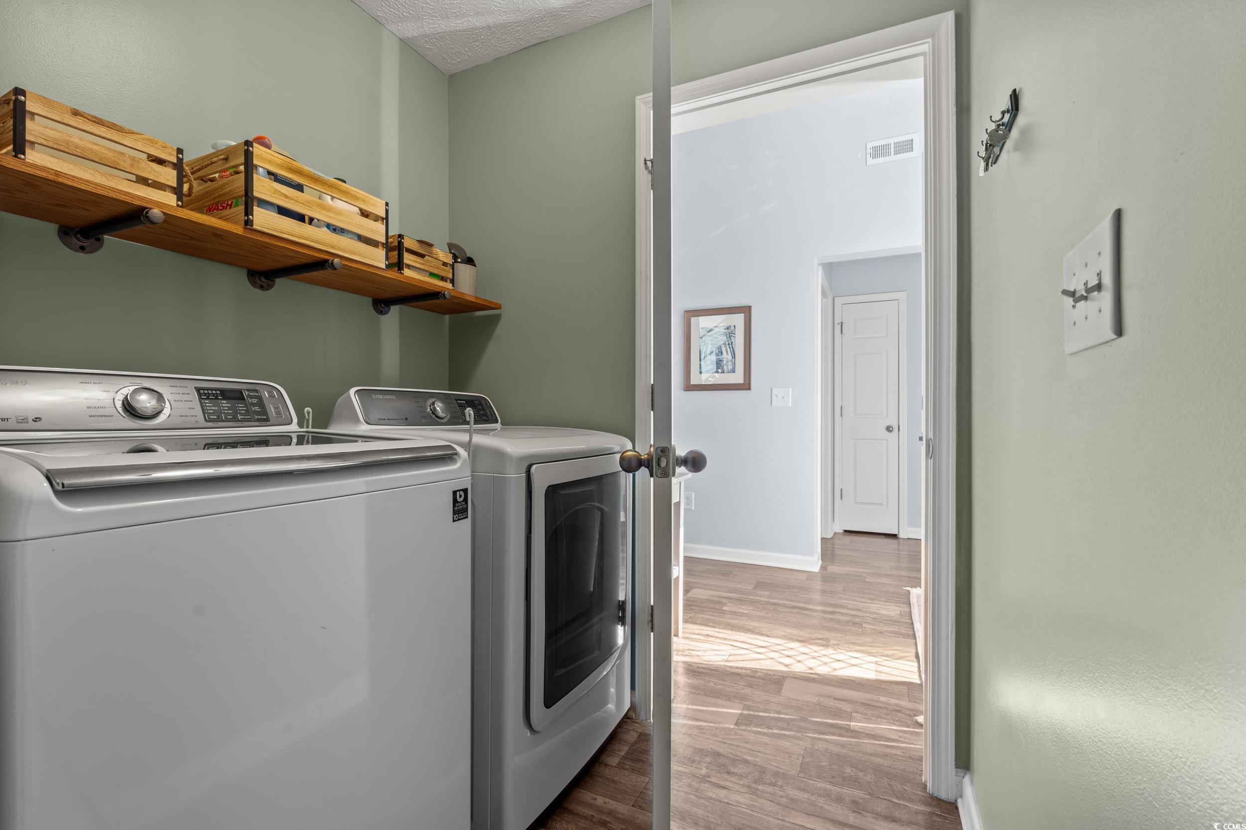 166 Woodland Park Loop Murrells Inlet, SC 29576 - Photo 25 of 39 Laundry room featuring hardwood / wood-style floor