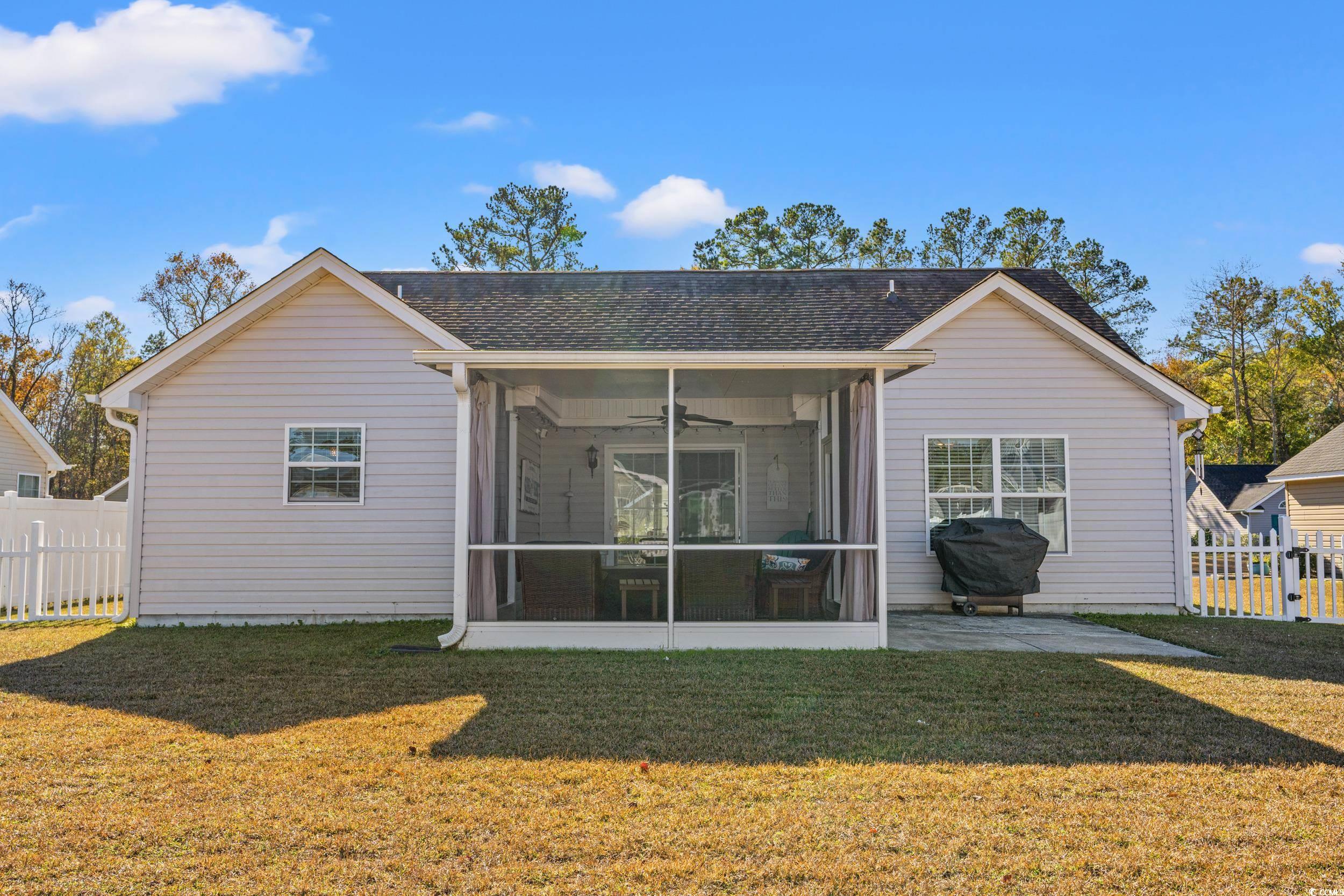 166 Woodland Park Loop Murrells Inlet, SC 29576 - Photo 28 of 39 Back of property featuring a sunroom, ceiling fan,