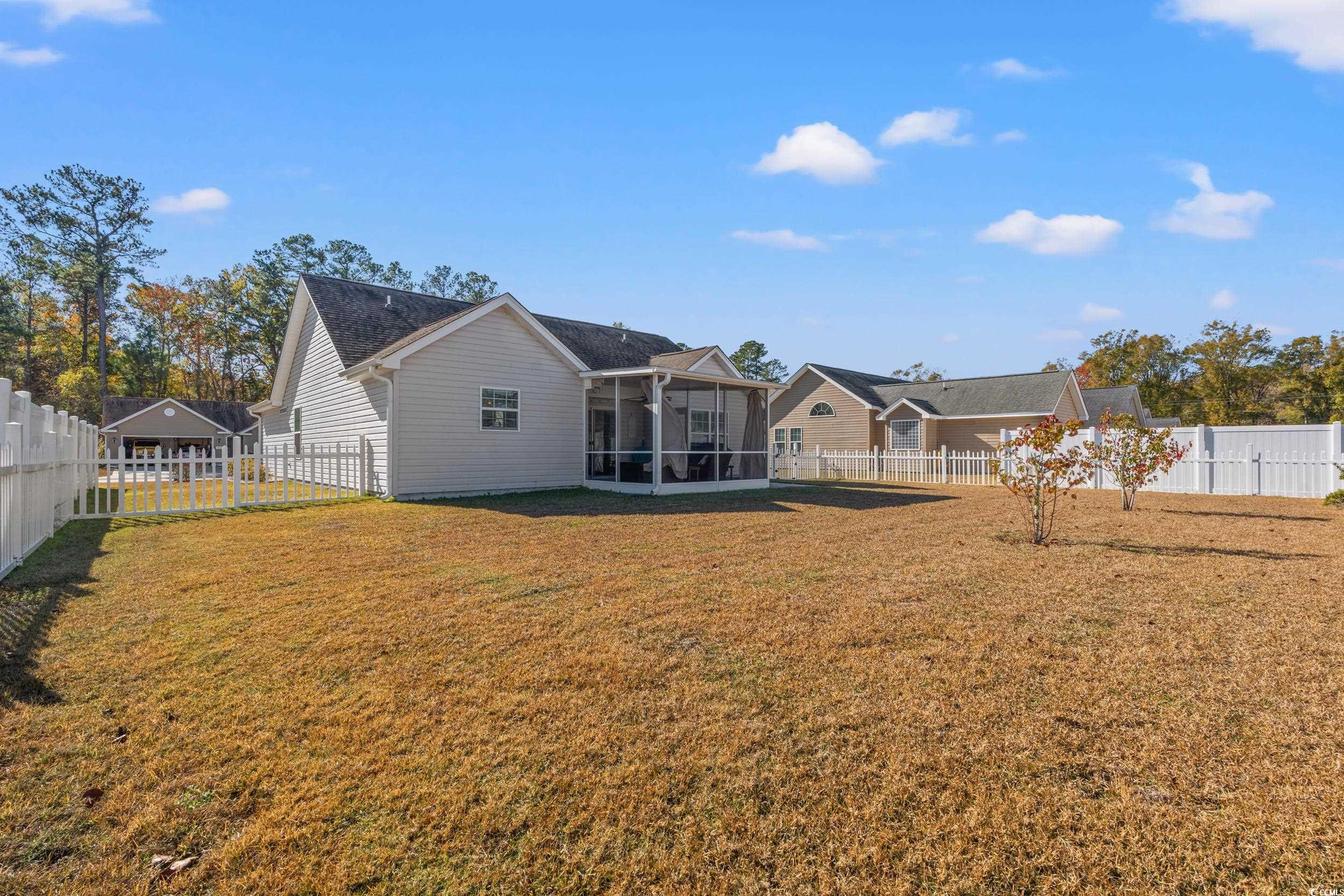 166 Woodland Park Loop Murrells Inlet, SC 29576 - Photo 29 of 39 Back of house featuring a sunroom and a yard