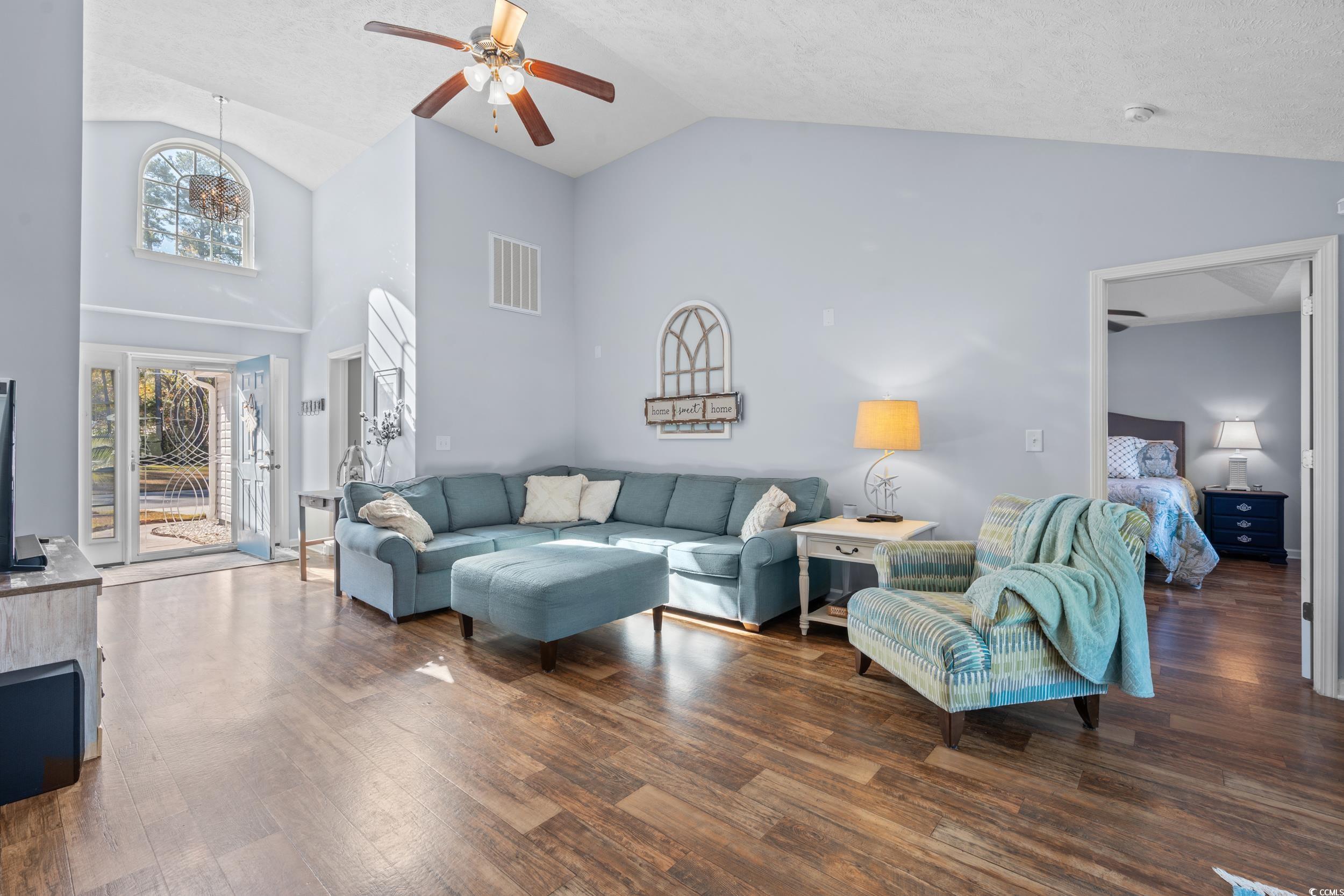 166 Woodland Park Loop Murrells Inlet, SC 29576 - Photo 3 of 39 Living room with a textured ceiling, dark hardwood