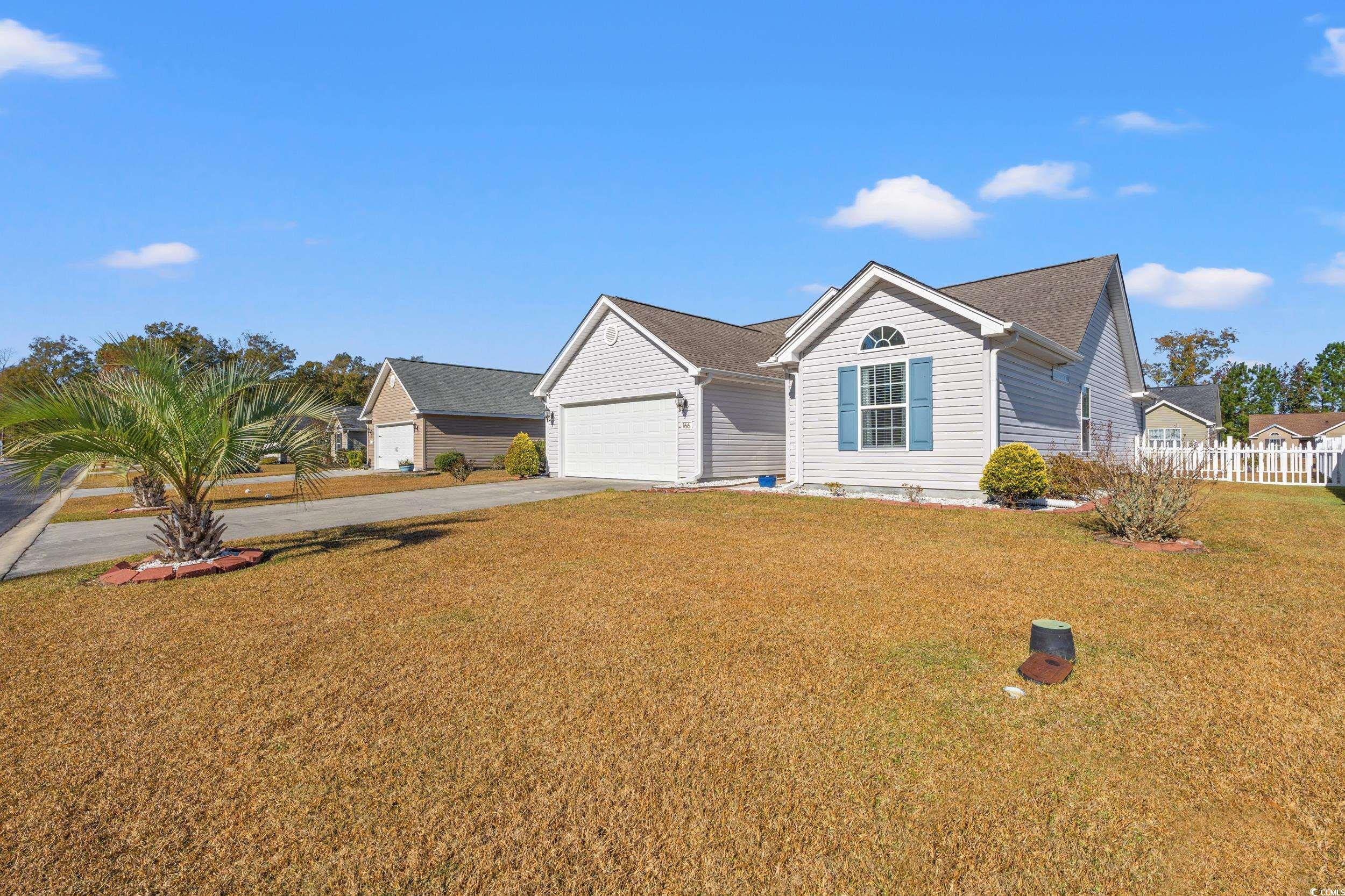 166 Woodland Park Loop Murrells Inlet, SC 29576 - Photo 32 of 39 Single story home with a garage and a front yard