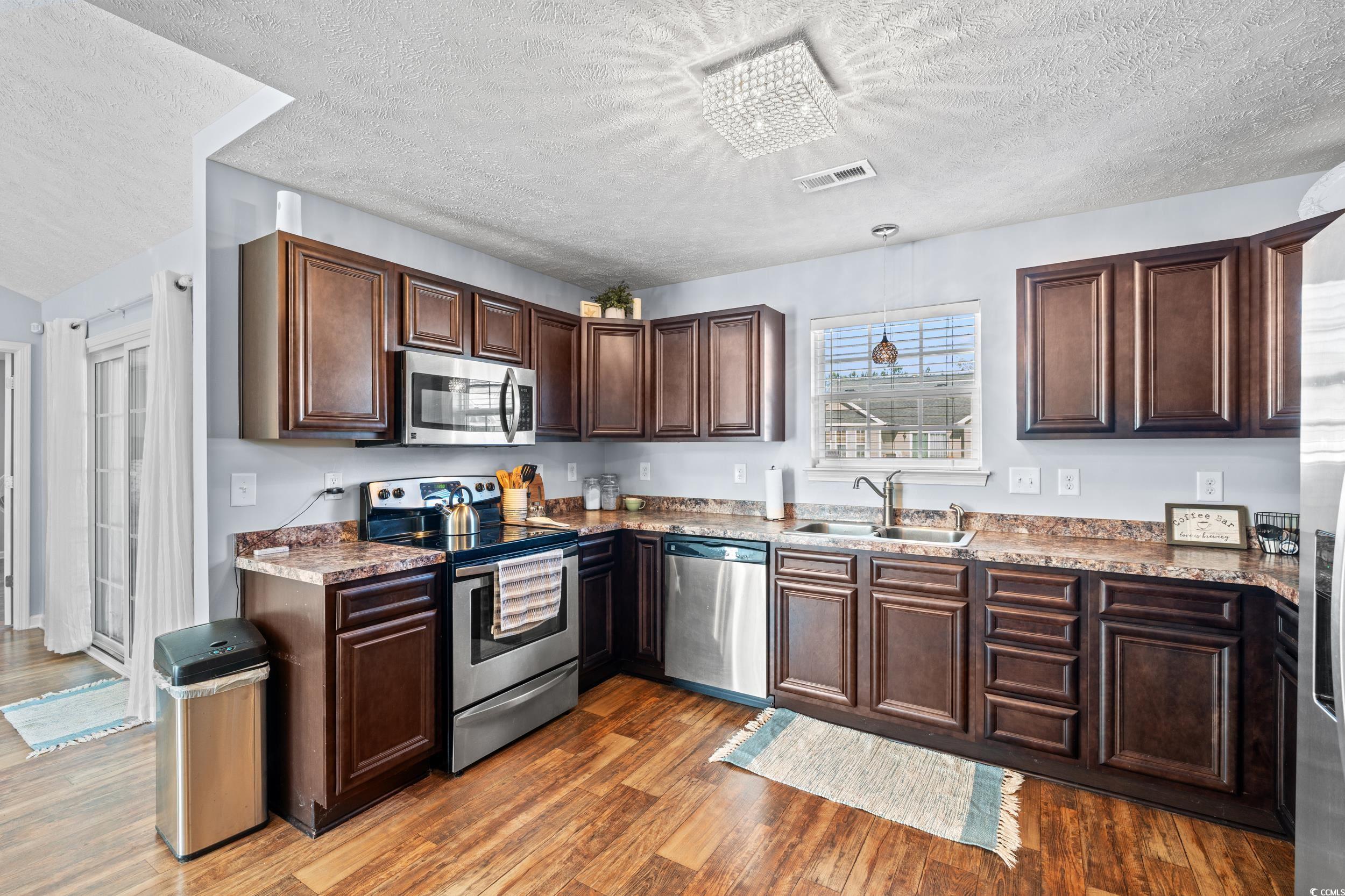 166 Woodland Park Loop Murrells Inlet, SC 29576 - Photo 7 of 39 Kitchen with appliances with stainless steel finis