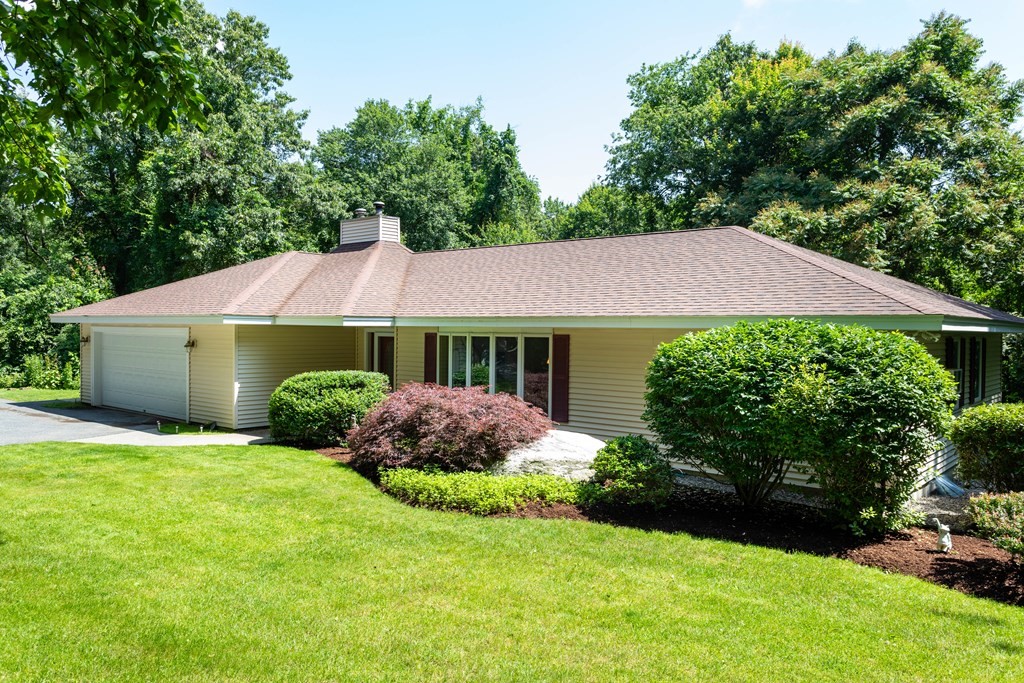94 Dudley Road Sutton, MA 01590 - Photo 3 of 42 a view of house with garden and tall trees