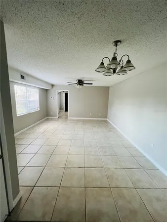 a view of a livingroom with wooden floor and a sink
