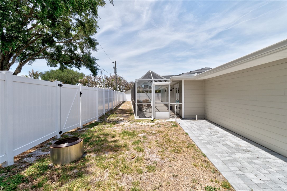 7989 143rd Street Sebastian, FL 32958 - Photo 27 of 30 a view of a backyard of the house