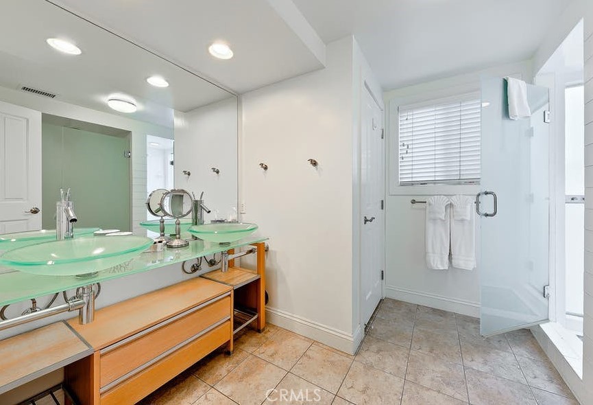 35087 Beach Road Dana Point, CA 92624 - Photo 11 of 31 a bathroom with a double vanity sink and a mirror