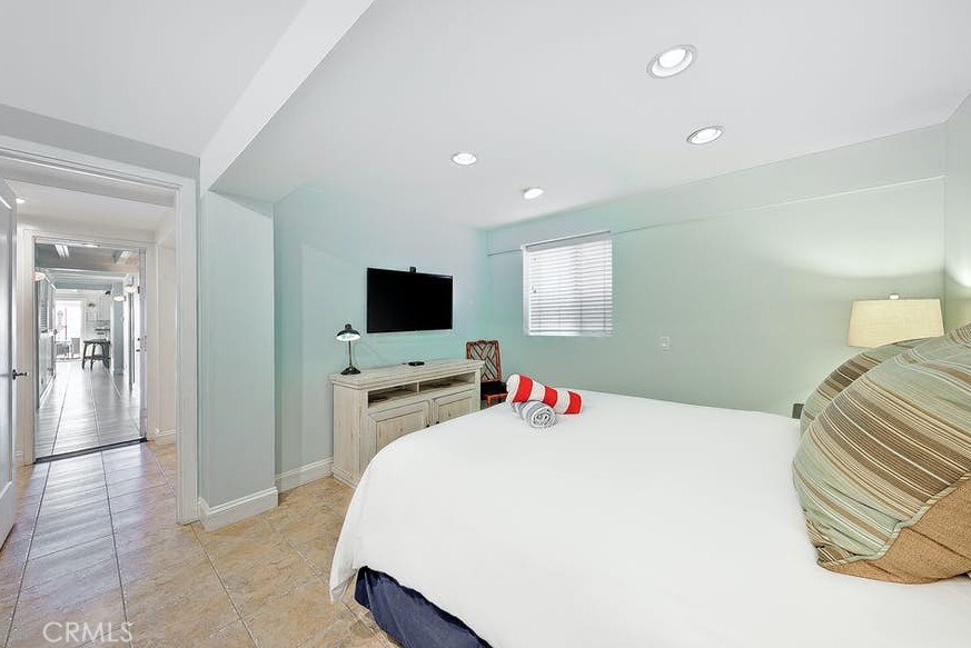 35087 Beach Road Dana Point, CA 92624 - Photo 13 of 31 a bedroom with a bed and a flat screen tv
