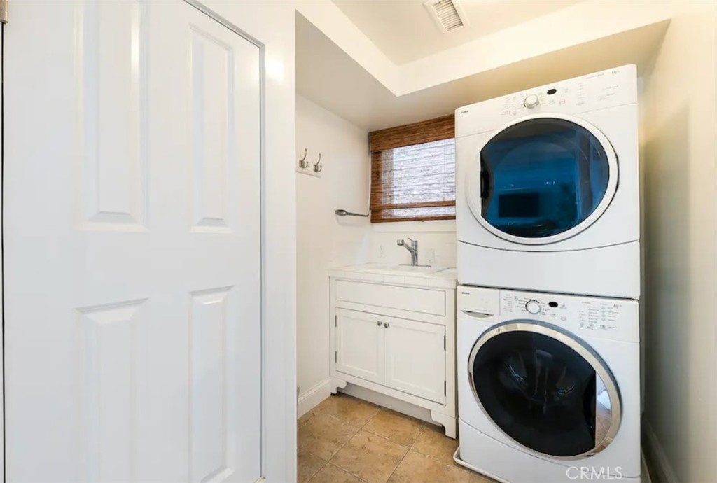 35087 Beach Road Dana Point, CA 92624 - Photo 25 of 31 a view of a hallway with washer and dryer
