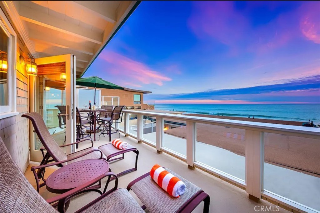35087 Beach Road Dana Point, CA 92624 - Photo 10 of 31 a view of a chairs and table in a balcony