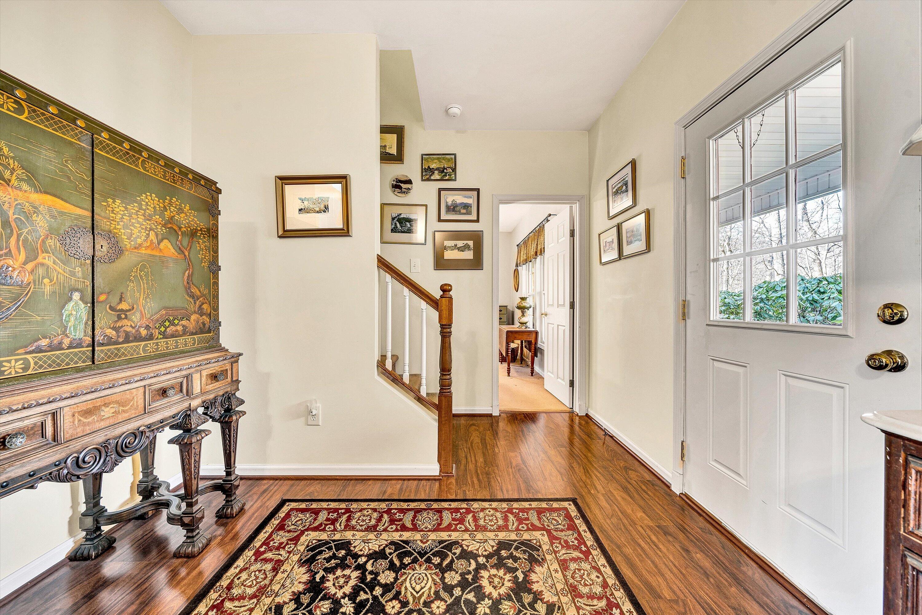 1164 Dry Hill Road Ferrum, VA 24088 - Photo 11 of 84 a view of a hallway with wooden floor and dining room