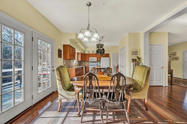a kitchen with stainless steel appliances granite countertop a sink and wooden cabinets