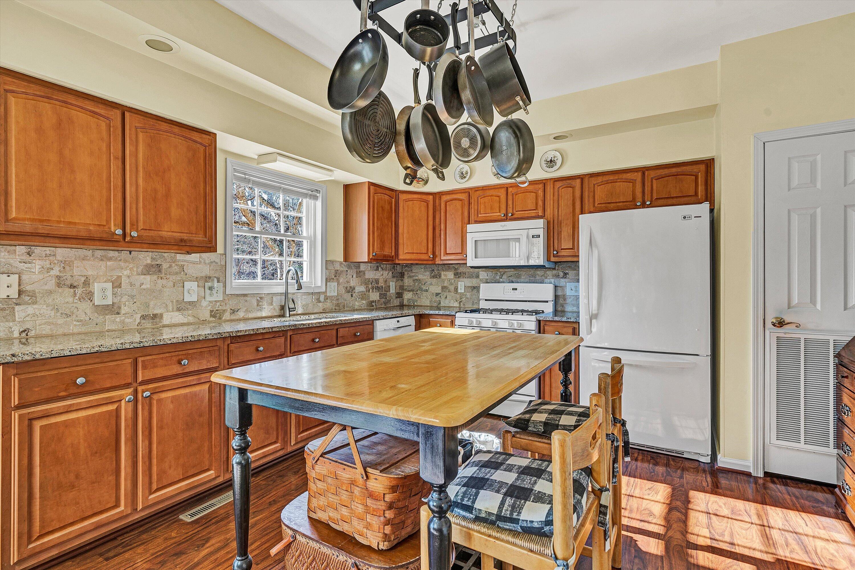 1164 Dry Hill Road Ferrum, VA 24088 - Photo 22 of 84 a kitchen with stainless steel appliances granite countertop a refrigerator and a sink