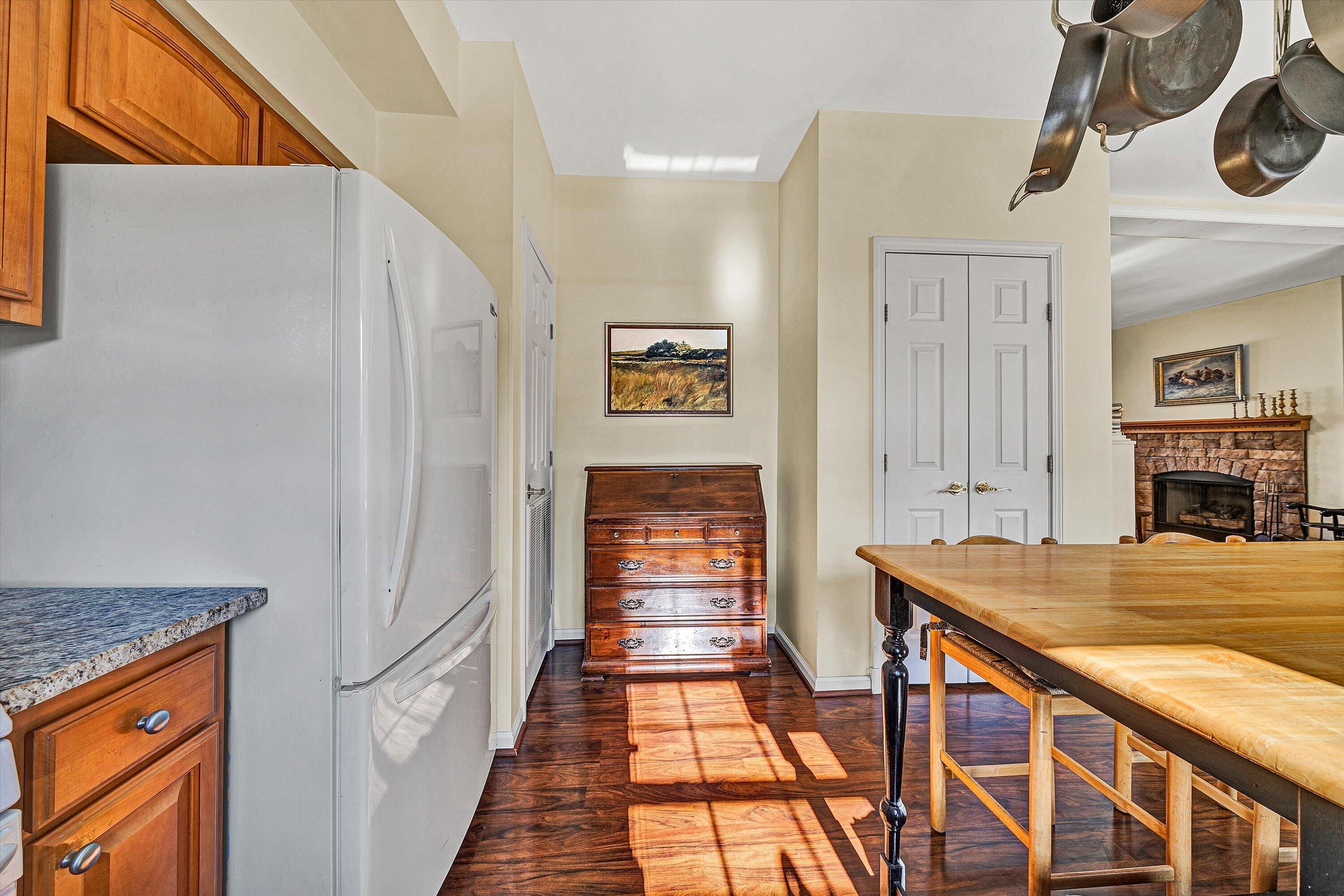 1164 Dry Hill Road Ferrum, VA 24088 - Photo 25 of 84 a view of a hallway to a livingroom with wooden floor fireplace and windows