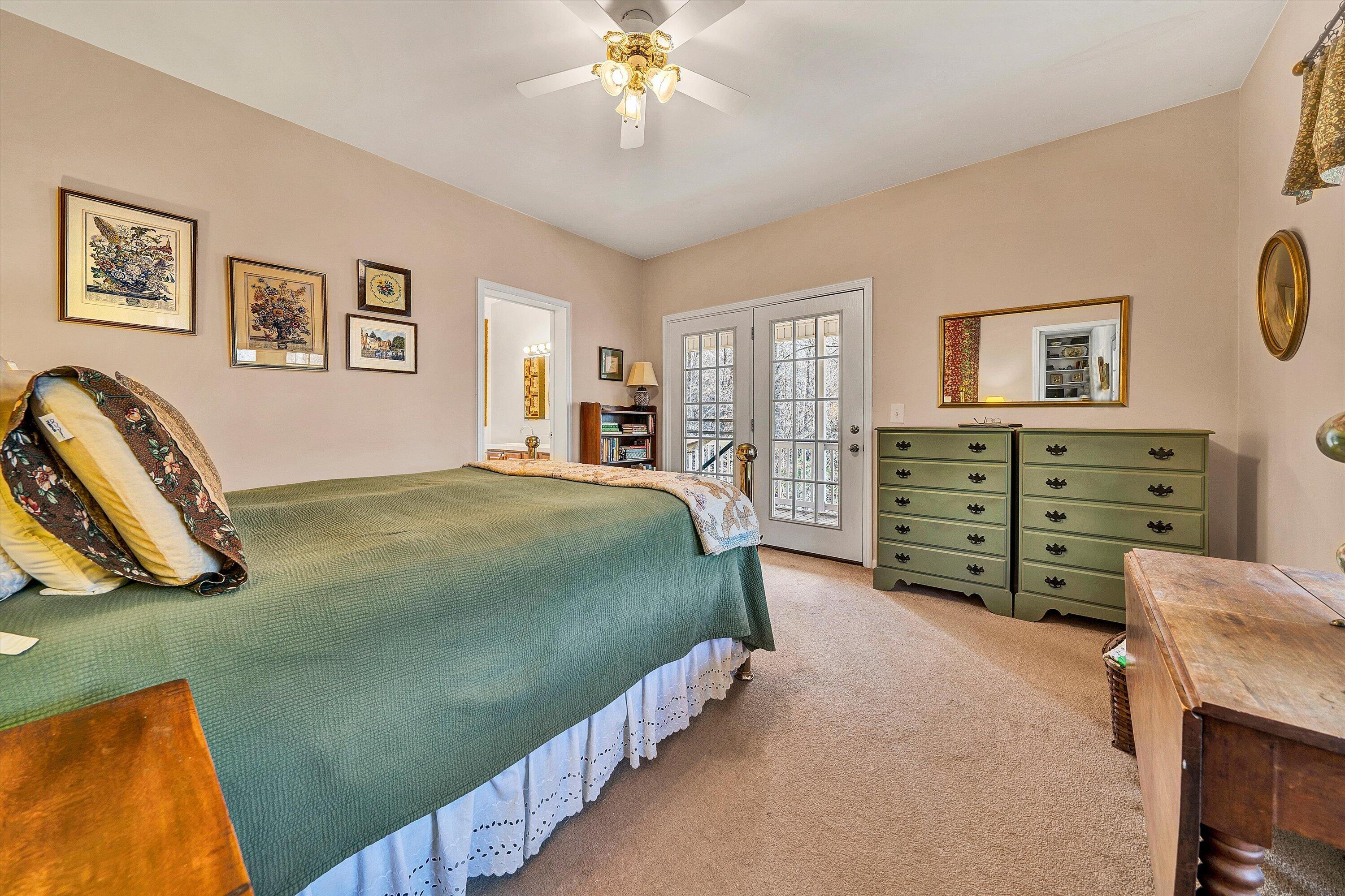 1164 Dry Hill Road Ferrum, VA 24088 - Photo 31 of 84 a bedroom with a bed and a chandelier