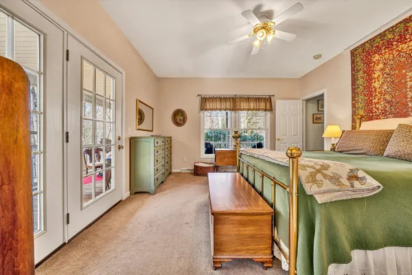 a dining room with stainless steel appliances granite countertop a dining table and chairs with the wooden floor