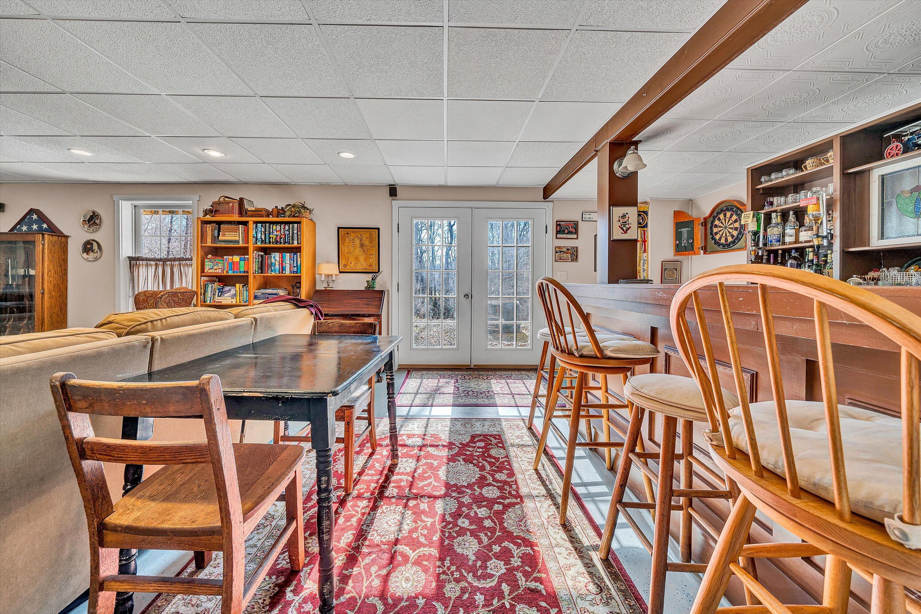 1164 Dry Hill Road Ferrum, VA 24088 - Photo 49 of 84 a dining room with stainless steel appliances granite countertop a dining table and chairs with the wooden floor