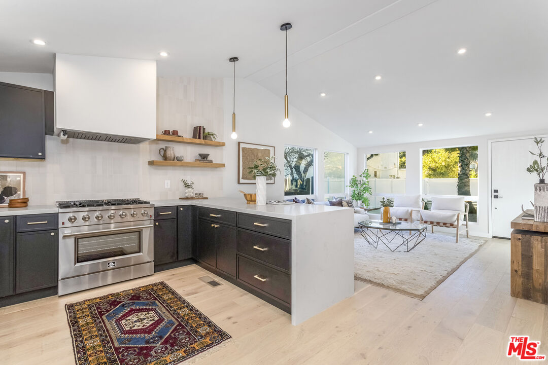 950 North Summit Avenue Pasadena, CA 91103 - Photo 1 of 37 a kitchen with a stove a sink and a refrigerator