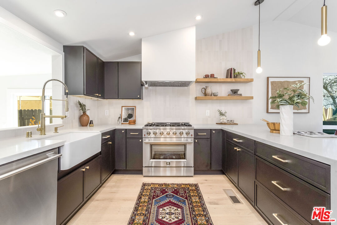 950 North Summit Avenue Pasadena, CA 91103 - Photo 15 of 37 a kitchen with a stove top oven sink and cabinets