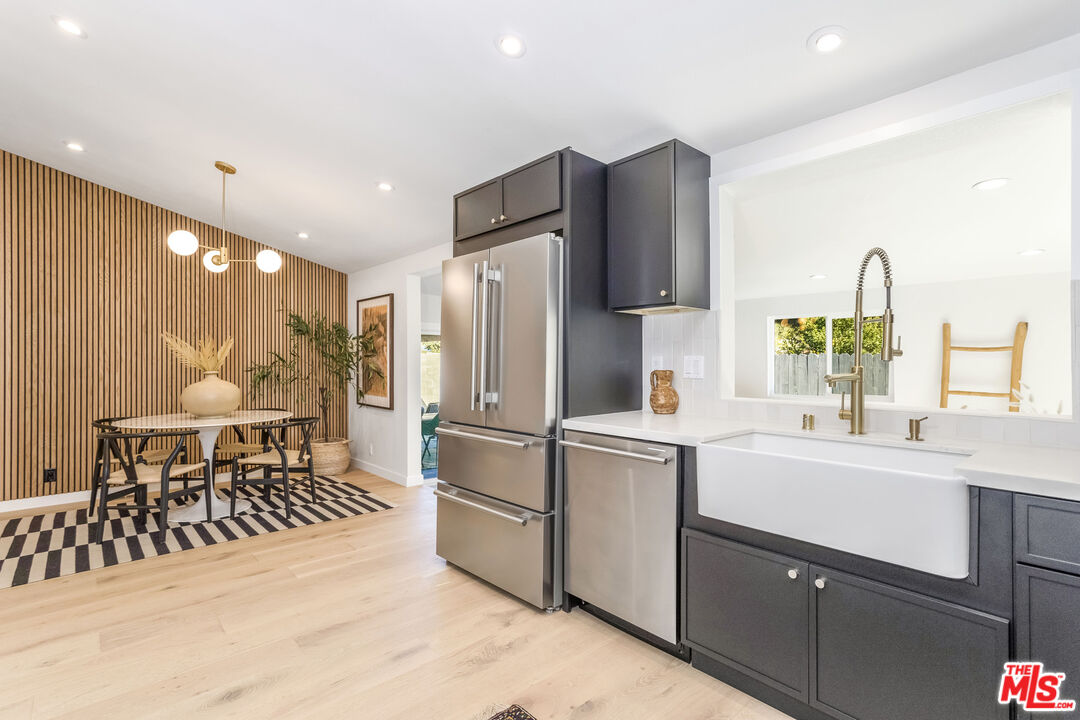 950 North Summit Avenue Pasadena, CA 91103 - Photo 18 of 37 a kitchen with a sink appliances and cabinets