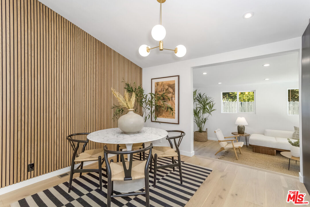 950 North Summit Avenue Pasadena, CA 91103 - Photo 19 of 37 a view of a dining room with furniture and wooden floor