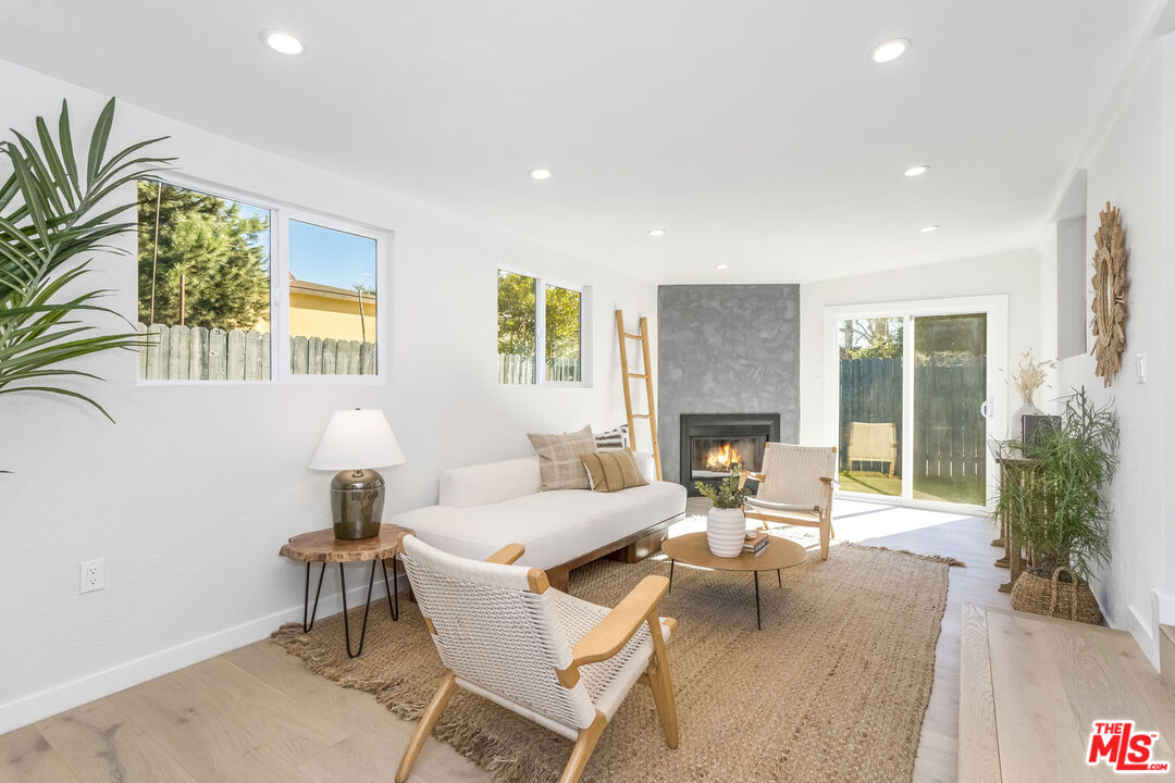 950 North Summit Avenue Pasadena, CA 91103 - Photo 21 of 37 a living room with furniture and a fireplace