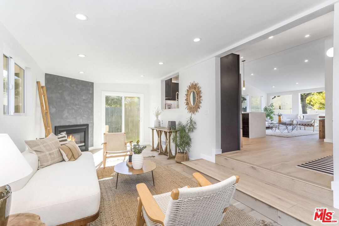 950 North Summit Avenue Pasadena, CA 91103 - Photo 22 of 37 a living room with fireplace furniture and a large window