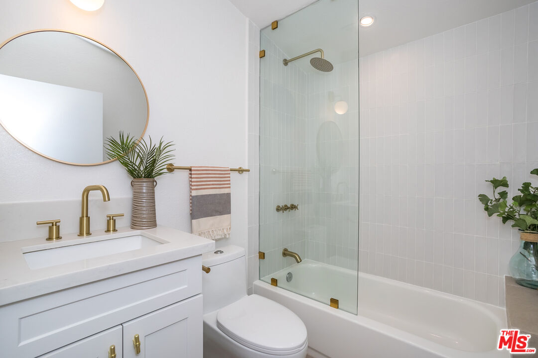 950 North Summit Avenue Pasadena, CA 91103 - Photo 31 of 37 a bathroom with a sink a toilet and shower