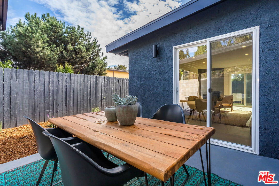 950 North Summit Avenue Pasadena, CA 91103 - Photo 34 of 37 a view of a dinning table and chairs in the patio