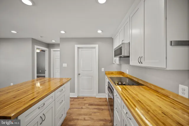 a kitchen with a sink and refrigerator