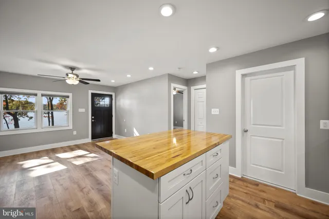 a kitchen with granite countertop a stove and a sink
