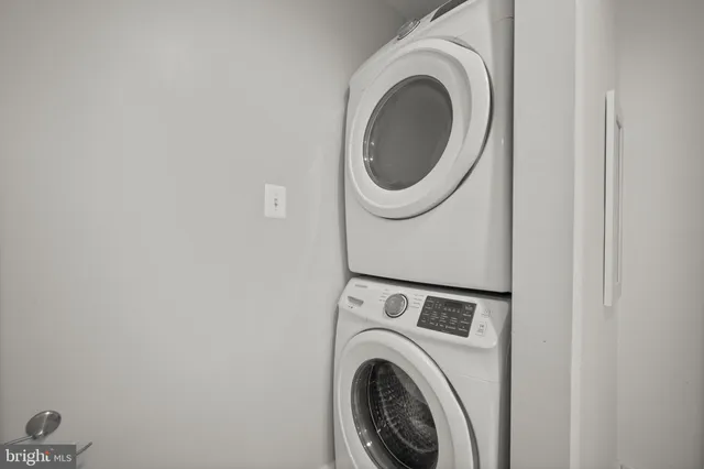 a white toilet sitting next to a sink