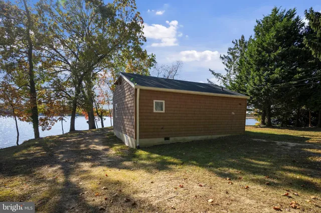 a view of a tree in front of a house