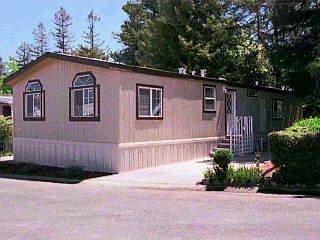 2 Bluejay Drive, Unit 155 Santa Rosa, CA 95409 - Photo 1 of 1 a front view of a house with garden