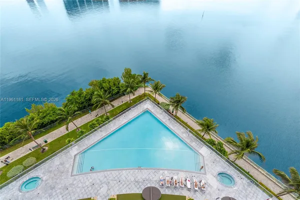 a view of swimming pool from a lake view