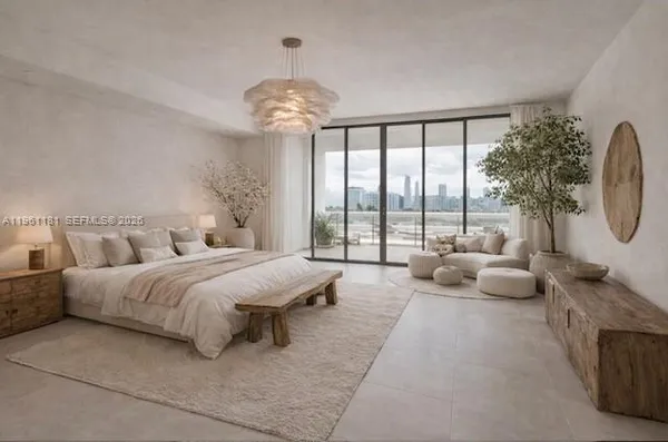 a spacious bedroom with a bed and a chandelier