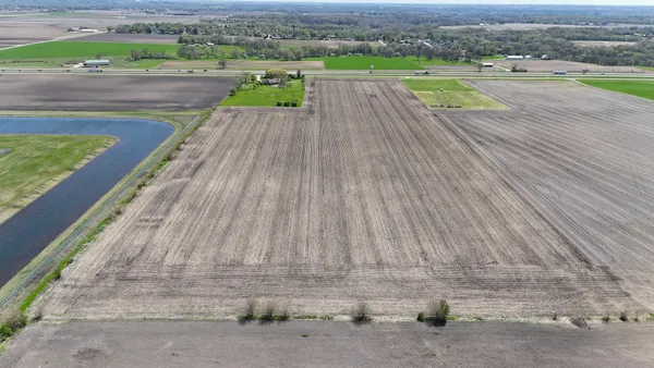 a view of a swimming pool with a lounge chair