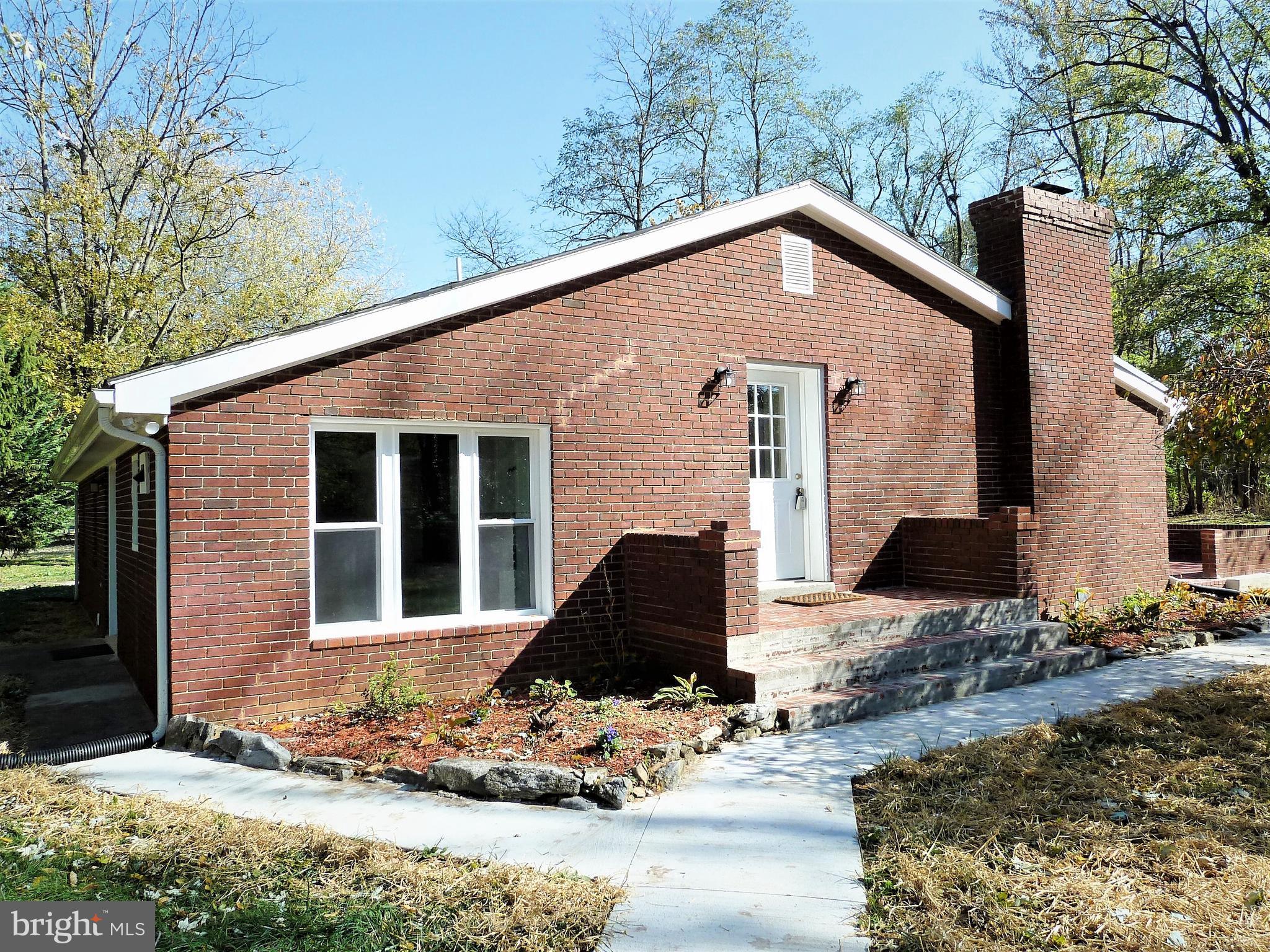 266 Thomson Street Summit Point, WV 25446 - Photo 1 of 46 Lovely brick entrance with porch