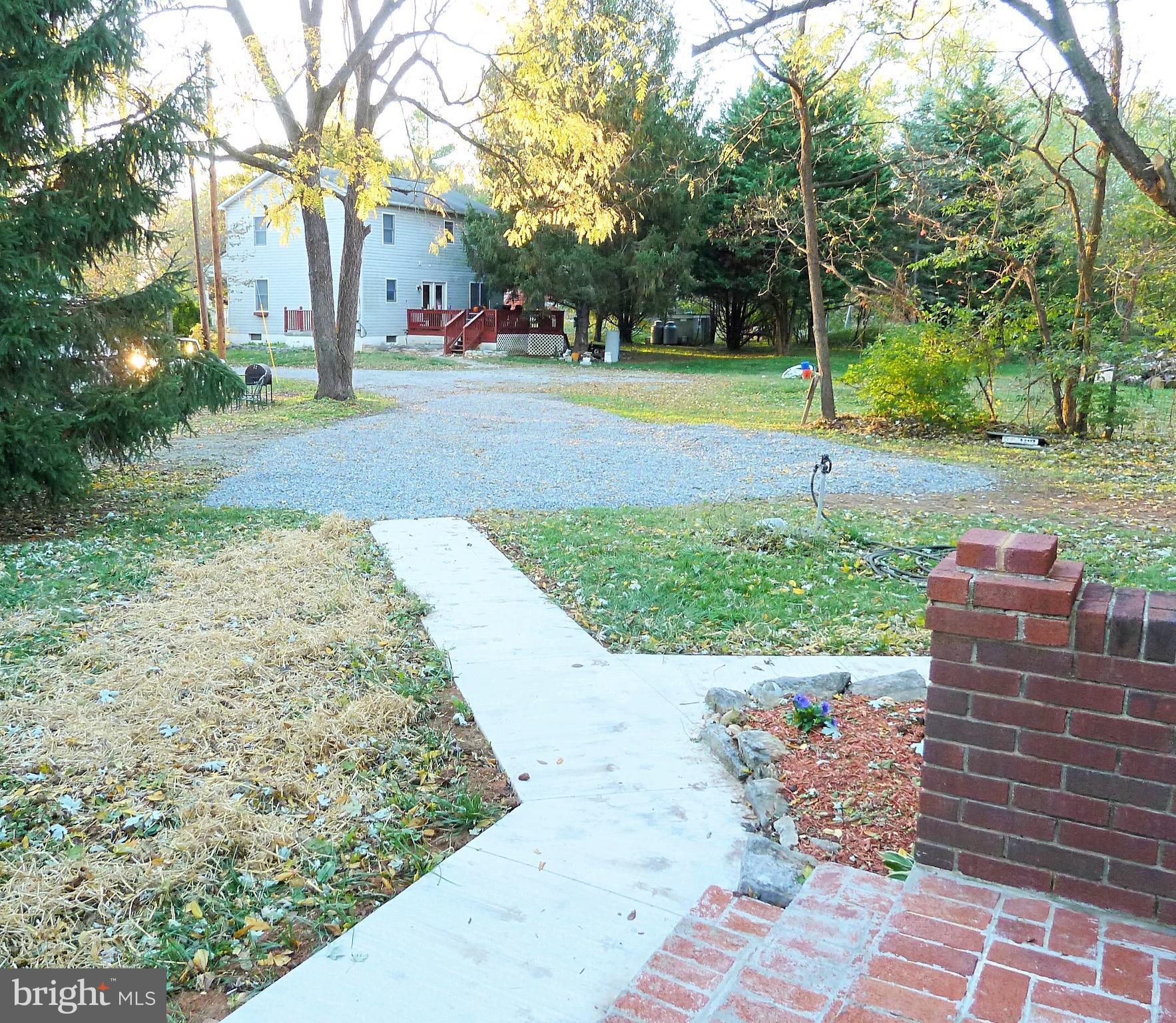 266 Thomson Street Summit Point, WV 25446 - Photo 17 of 46 Gravel driveway and walkway