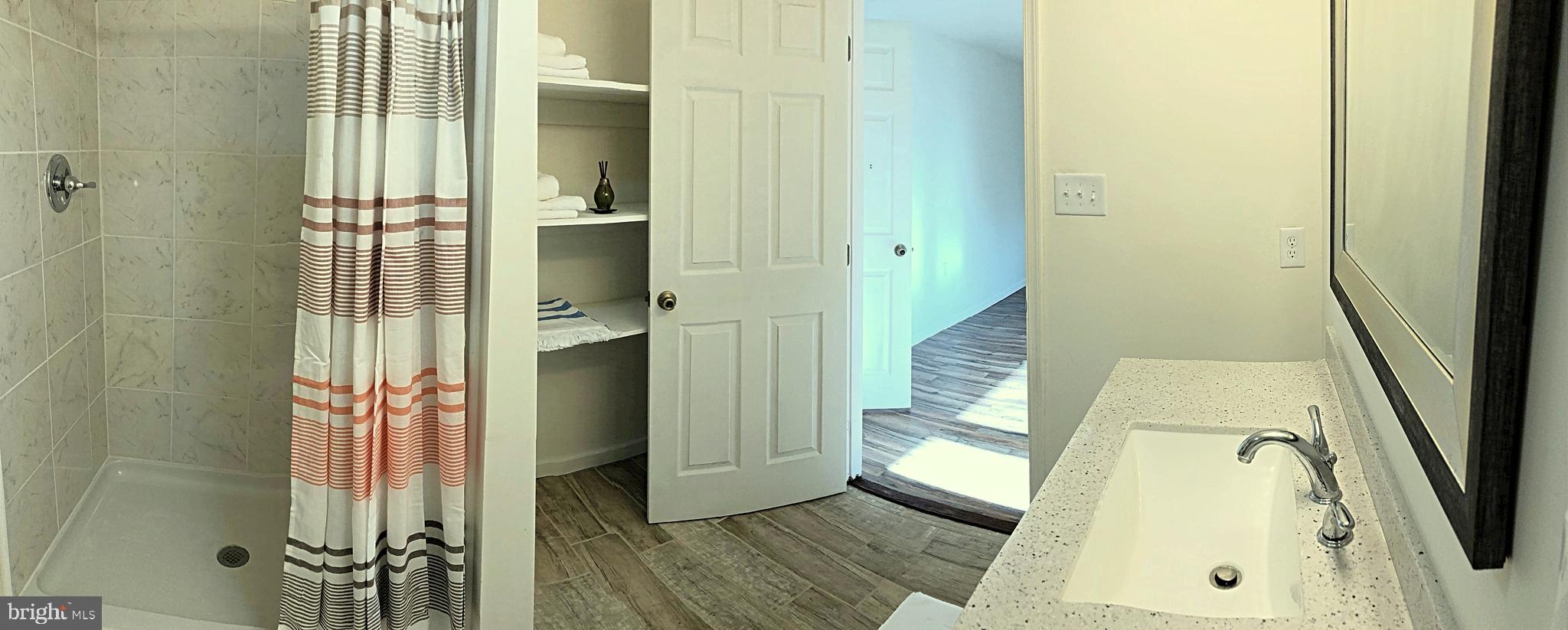 266 Thomson Street Summit Point, WV 25446 - Photo 22 of 46 Master bath has tile floors, & beautiful vanity