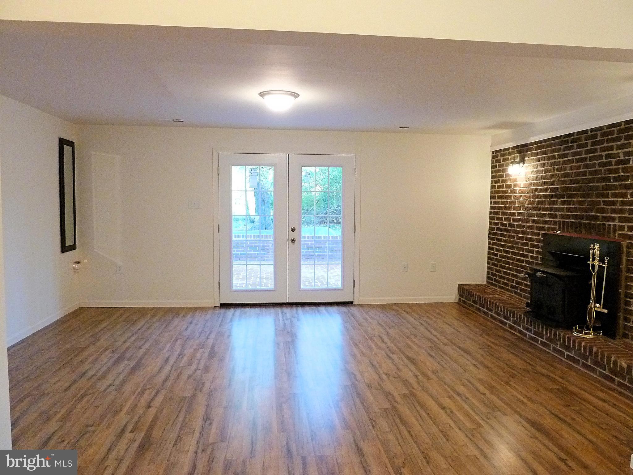 266 Thomson Street Summit Point, WV 25446 - Photo 37 of 46 French doors open to the brick patio
