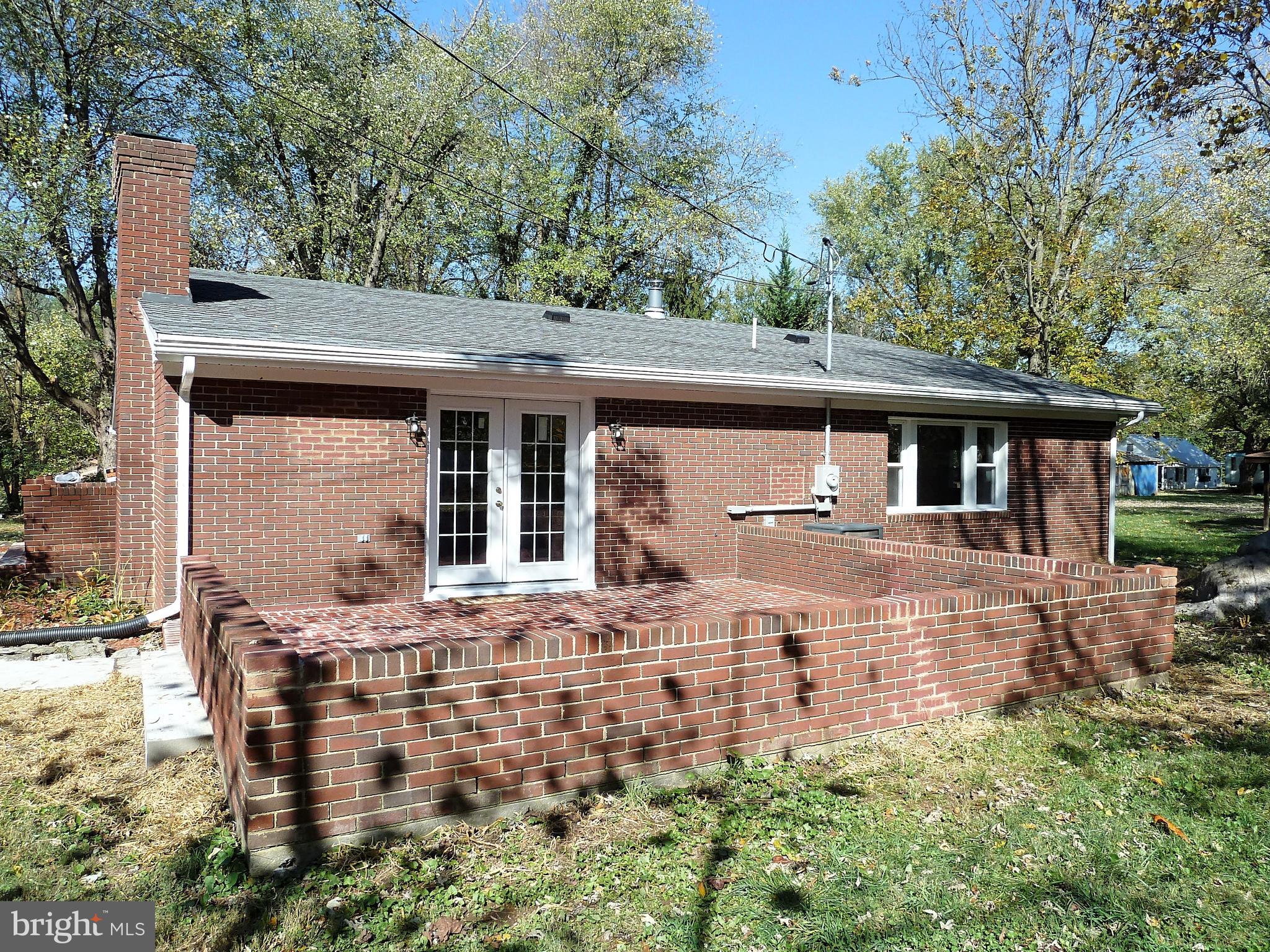 266 Thomson Street Summit Point, WV 25446 - Photo 8 of 46 Large brick patio on back