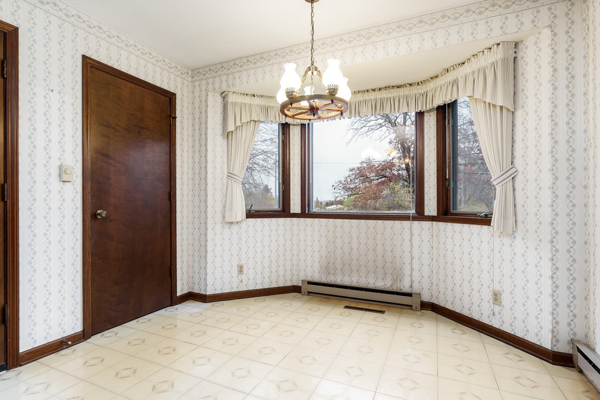 6644 Belvidere Road Roscoe, IL 61073 - Photo 21 of 42 a view of a room with a window and chandelier