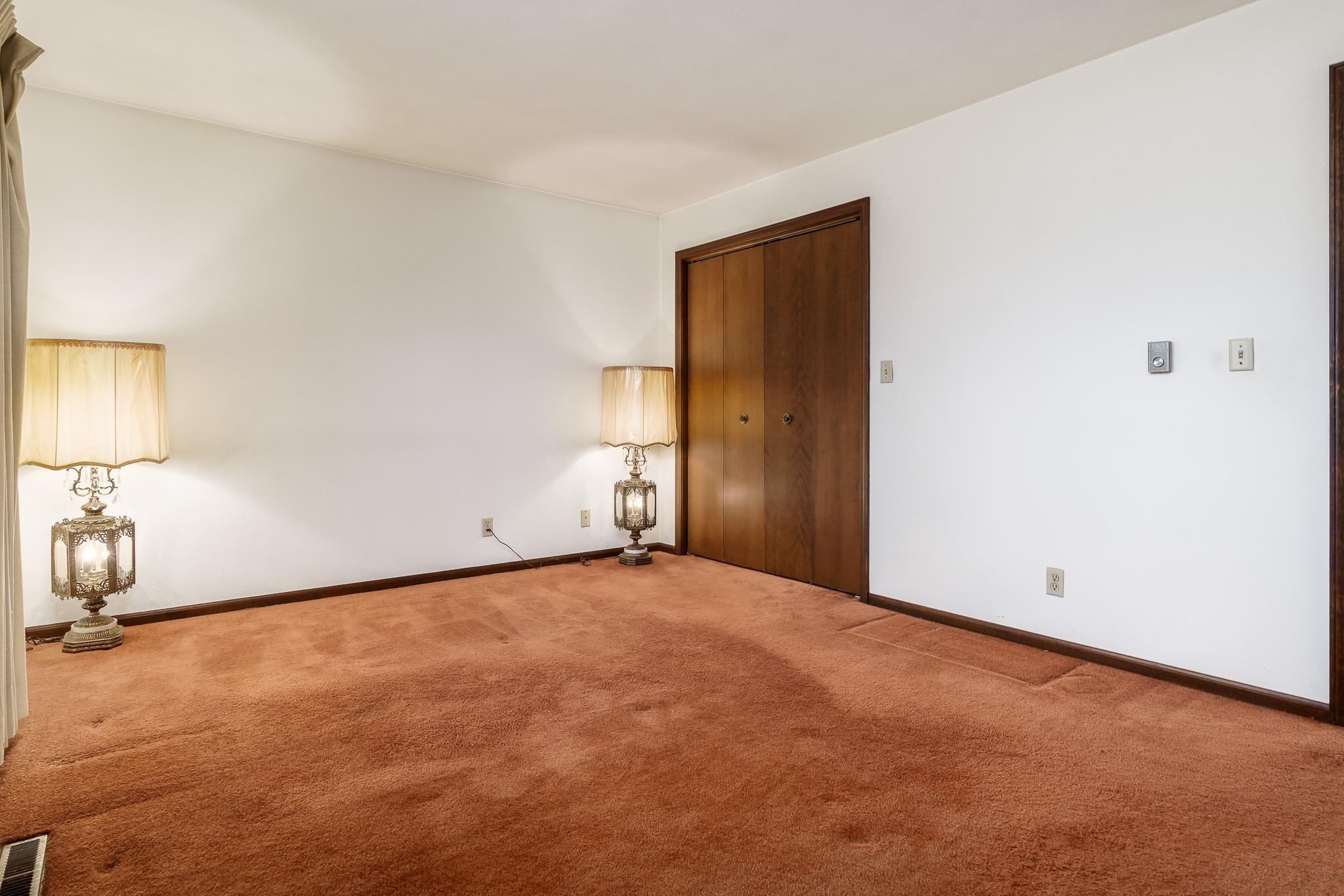 6644 Belvidere Road Roscoe, IL 61073 - Photo 33 of 42 a view of an empty room with a lamp